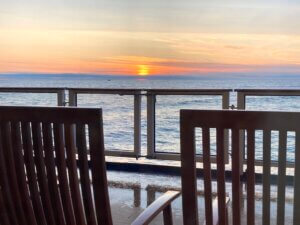 Blog header image showing deckchairs in sunset to suggest work-life balance.